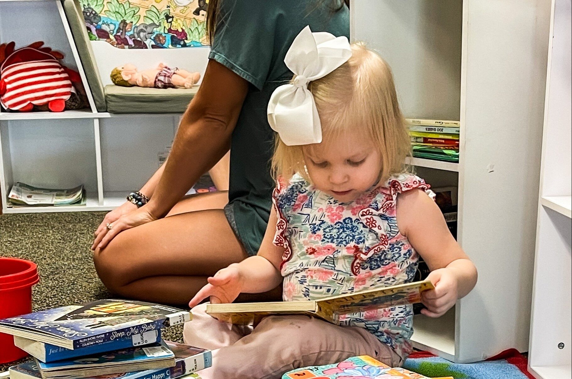 Young child reading books